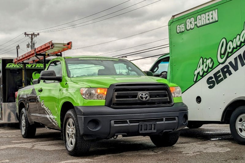 Service trucks from Air Conditioning Service, Inc. headed out to work on heat pump in Nashville home.