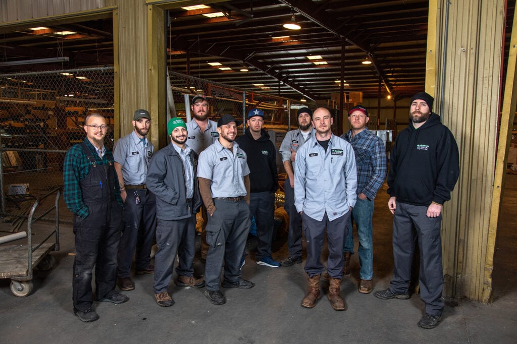 The Service Team from Air Conditioning Service, Inc, standing outside of the company warehouse in Nashville, TN.